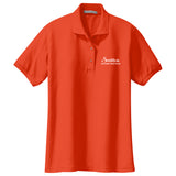 Orange ladies polo shirt with white logo